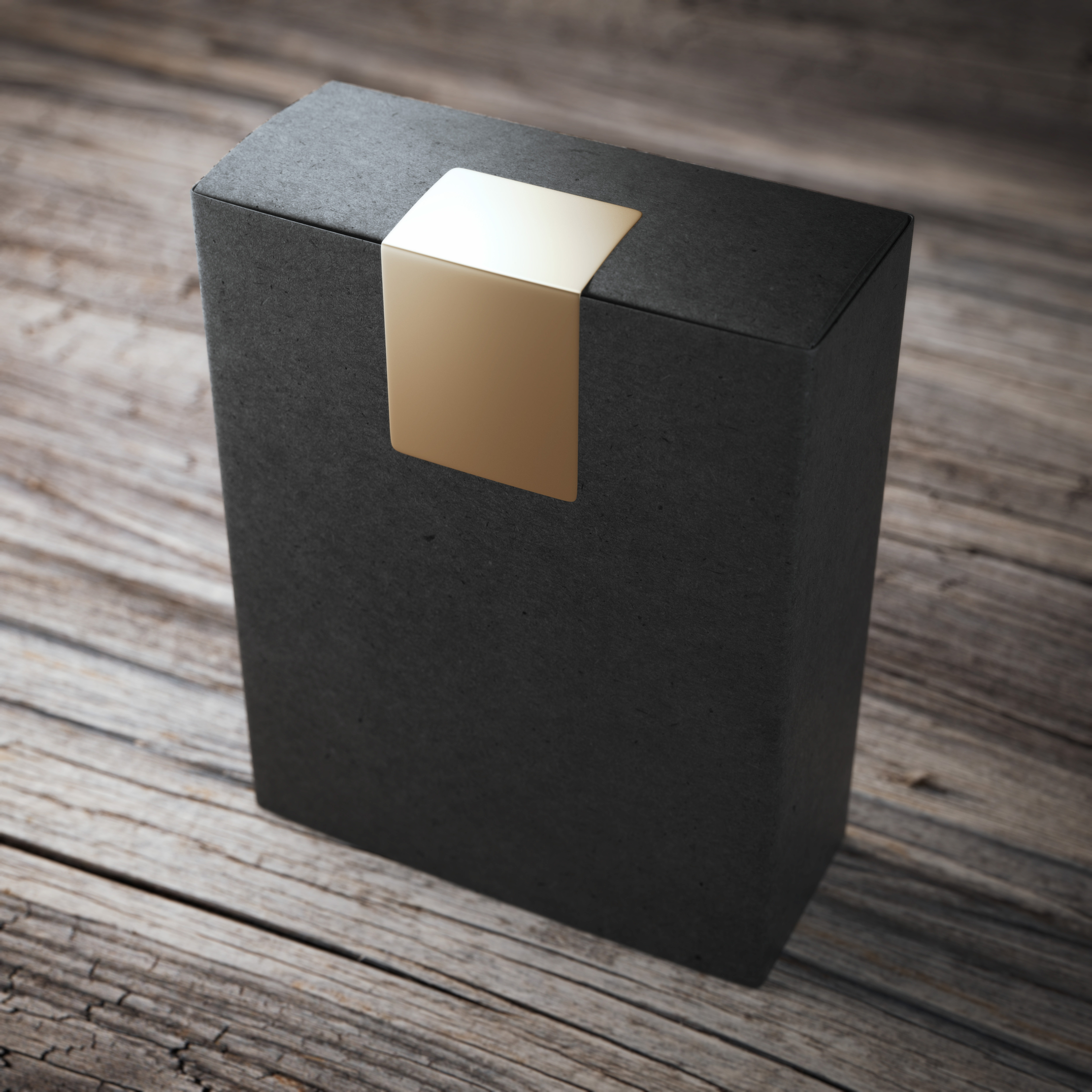 Black box with golden sticker on the wooden floor